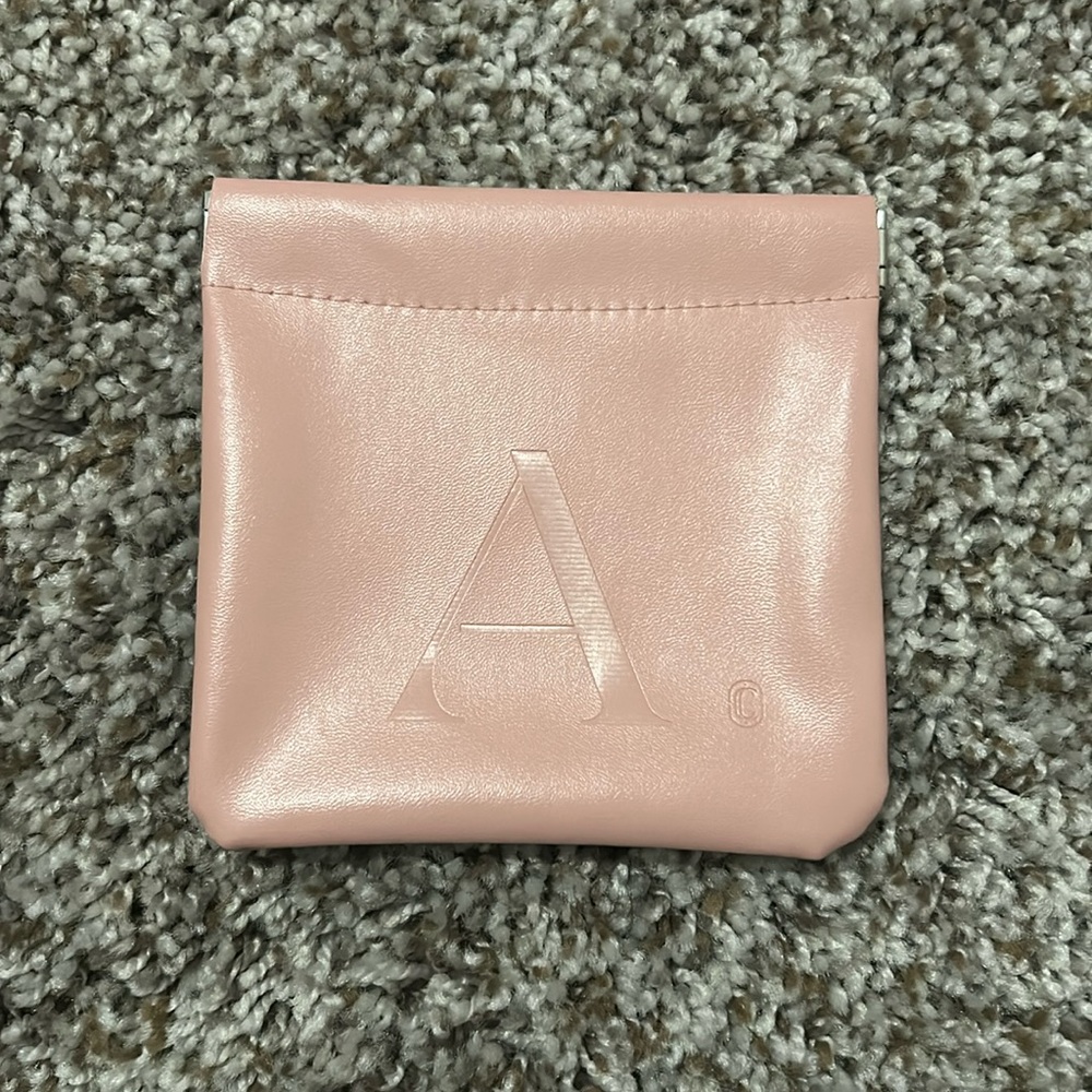 Pink A faux leather pouch